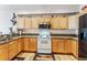 Bright kitchen with light wood cabinets, modern appliances, and granite counters at 57 Audrey Cir, Breckenridge, CO 80424