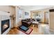 Comfortable living room featuring a fireplace and plenty of natural light at 57 Audrey Cir, Breckenridge, CO 80424