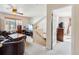 Inviting living room with carpeted floors, a ceiling fan and staircase access at 57 Audrey Cir, Breckenridge, CO 80424