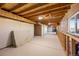 Unfinished basement with exposed ceiling and a window at 1788 Shoshone Trl, Elizabeth, CO 80107