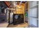 Basement with laundry area, storage, and utilities including water heater and furnace at 1788 Shoshone Trl, Elizabeth, CO 80107