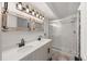 Bathroom featuring double sink vanity and glass enclosed shower at 1788 Shoshone Trl, Elizabeth, CO 80107