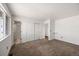 A carpeted bedroom with a window and closet at 1788 Shoshone Trl, Elizabeth, CO 80107