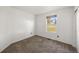 Bedroom with neutral carpet, white walls and a window at 1788 Shoshone Trl, Elizabeth, CO 80107