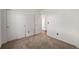 A bedroom with neutral carpet and a closet at 1788 Shoshone Trl, Elizabeth, CO 80107