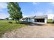 Well-maintained single story house featuring a large yard and an attached garage with a gravel driveway at 1788 Shoshone Trl, Elizabeth, CO 80107