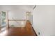 Hallway with hardwood floors, white walls, and plenty of natural light at 1788 Shoshone Trl, Elizabeth, CO 80107