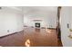 A bright living room boasts wood floors, a fireplace, and ample space for relaxing at 1788 Shoshone Trl, Elizabeth, CO 80107