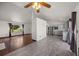 Open floor plan with stainless steel appliances, gray cabinets, and hardwood floors at 1788 Shoshone Trl, Elizabeth, CO 80107