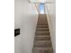 A carpeted staircase leads to an upper level at 1788 Shoshone Trl, Elizabeth, CO 80107