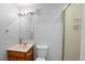 Clean bathroom with light gray walls, oak vanity and enclosed shower with glass doors at 19118 E Grand Cir, Aurora, CO 80015