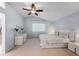 Bright bedroom with a vaulted ceiling, ceiling fan, and white furniture set at 19118 E Grand Cir, Aurora, CO 80015