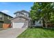 Charming two-story home featuring a well-maintained lawn, brick accents, and a spacious two-car garage at 19118 E Grand Cir, Aurora, CO 80015