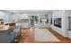 Open kitchen features granite countertops, stainless steel appliances, modern bar stools and natural light at 19118 E Grand Cir, Aurora, CO 80015