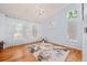 Elegant living room with hardwood floors, a chandelier, and lots of natural light at 19118 E Grand Cir, Aurora, CO 80015