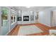 Cozy living space adjacent to the kitchen with a modern fireplace and access to an outdoor area at 19118 E Grand Cir, Aurora, CO 80015