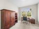Bedroom with a large window letting in lots of natural light and wood desk at 6174 Flattop St, Golden, CO 80403