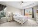 Comfortable bedroom with a king-size bed, tray ceiling, and large windows at 6174 Flattop St, Golden, CO 80403