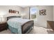 Bedroom with dark wood bed frame, neutral paint, and natural light at 6174 Flattop St, Golden, CO 80403