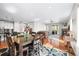 Open-concept dining area leading to a cozy living room and modern kitchen at 6174 Flattop St, Golden, CO 80403