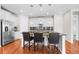 Bright kitchen with stainless steel appliances, granite counters, and convenient breakfast bar seating at 6174 Flattop St, Golden, CO 80403