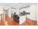 Modern kitchen with stainless steel appliances, granite countertops, and a breakfast bar at 6174 Flattop St, Golden, CO 80403