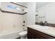 Clean bathroom with a bathtub, shower, and modern vanity at 5480 Danube St, Denver, CO 80249