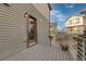 Small deck with composite decking, offering a view of the surrounding houses at 5480 Danube St, Denver, CO 80249