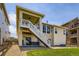 Charming backyard featuring a covered deck with staircase access and scenic outdoor space at 21855 E Idyllwilde Dr, Parker, CO 80138