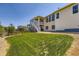 Spacious backyard with a well-manicured lawn and a charming two-story home at 21855 E Idyllwilde Dr, Parker, CO 80138