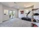 Bright basement featuring a treadmill, sliding glass doors to the outside, and soft carpeting at 21855 E Idyllwilde Dr, Parker, CO 80138