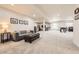 Expansive finished basement offering versatile space for recreation and relaxation with neutral carpet at 21855 E Idyllwilde Dr, Parker, CO 80138