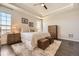 Bright bedroom with large windows, hardwood floors, and neutral decor, perfect for relaxation at 21855 E Idyllwilde Dr, Parker, CO 80138