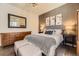 Inviting bedroom with hardwood floors, neutral colors, and elegant decor, providing a relaxing atmosphere at 21855 E Idyllwilde Dr, Parker, CO 80138