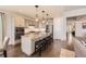 Stylish kitchen featuring stainless steel appliances, granite countertops, and an island with seating at 21855 E Idyllwilde Dr, Parker, CO 80138