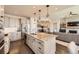 Well-designed kitchen island with granite countertops, pendant lights, and stainless steel appliances at 21855 E Idyllwilde Dr, Parker, CO 80138
