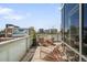 Balcony features lounge seating and cityscape views at 55 W 12Th Ave # 608, Denver, CO 80204