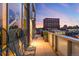 Outdoor balcony with seating, a grill, and city views, ideal for enjoying the sunset or the company of friends at 55 W 12Th Ave # 608, Denver, CO 80204