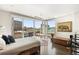 Sunlit bedroom boasting large windows and scenic cityscape views at 55 W 12Th Ave # 608, Denver, CO 80204