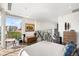 Bright, split-level bedroom boasting scenic city views from expansive windows at 55 W 12Th Ave # 608, Denver, CO 80204