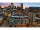 Urban landscape with residential building views and skyline in the background at twilight, offering a modern urban lifestyle at 55 W 12Th Ave # 608, Denver, CO 80204
