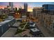 Rooftop view of the cityscape with modern architecture and sunset at 55 W 12Th Ave # 608, Denver, CO 80204