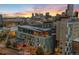 Overhead view of the building and the city skyline at sunset at 55 W 12Th Ave # 608, Denver, CO 80204