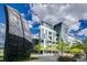 Stunning architectural design of a modern building with an eye-catching rock and well-kept green spaces at 55 W 12Th Ave # 608, Denver, CO 80204
