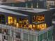 Exterior rooftop patio at dusk features modern design and scenic views at 55 W 12Th Ave # 608, Denver, CO 80204