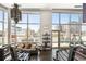 Inviting living room with floor-to-ceiling windows showcasing city views, accented by modern lighting and stylish decor at 55 W 12Th Ave # 608, Denver, CO 80204