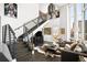 Living room featuring hardwood floors, a staircase, and an open layout creating a modern and inviting atmosphere at 55 W 12Th Ave # 608, Denver, CO 80204