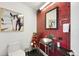 Quirky powder room with red mosaic tiles and unique artistic elements at 55 W 12Th Ave # 608, Denver, CO 80204