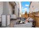 Backyard patio with outdoor seating, coffee table and wood privacy fence at 6041 N Orleans St, Aurora, CO 80019