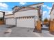 Exterior of a two-story home featuring a two car garage and a driveway at 6041 N Orleans St, Aurora, CO 80019